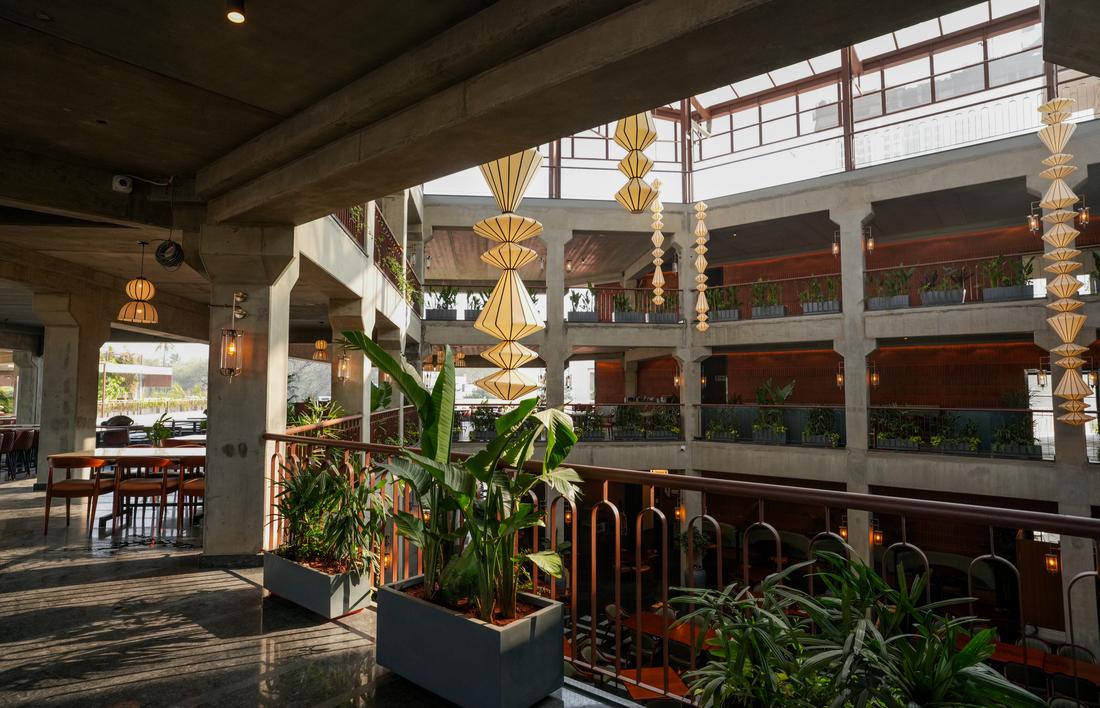 Arched architecture and hanging gold ornaments at Legacy Brewing Company