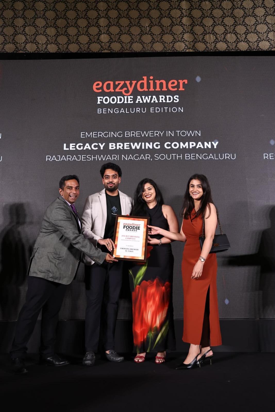 The Legacy Brewing Company team accepting the Best Emerging Microbrewery award at the EazyDiner Foodie Awards 2026, Bengaluru Edition