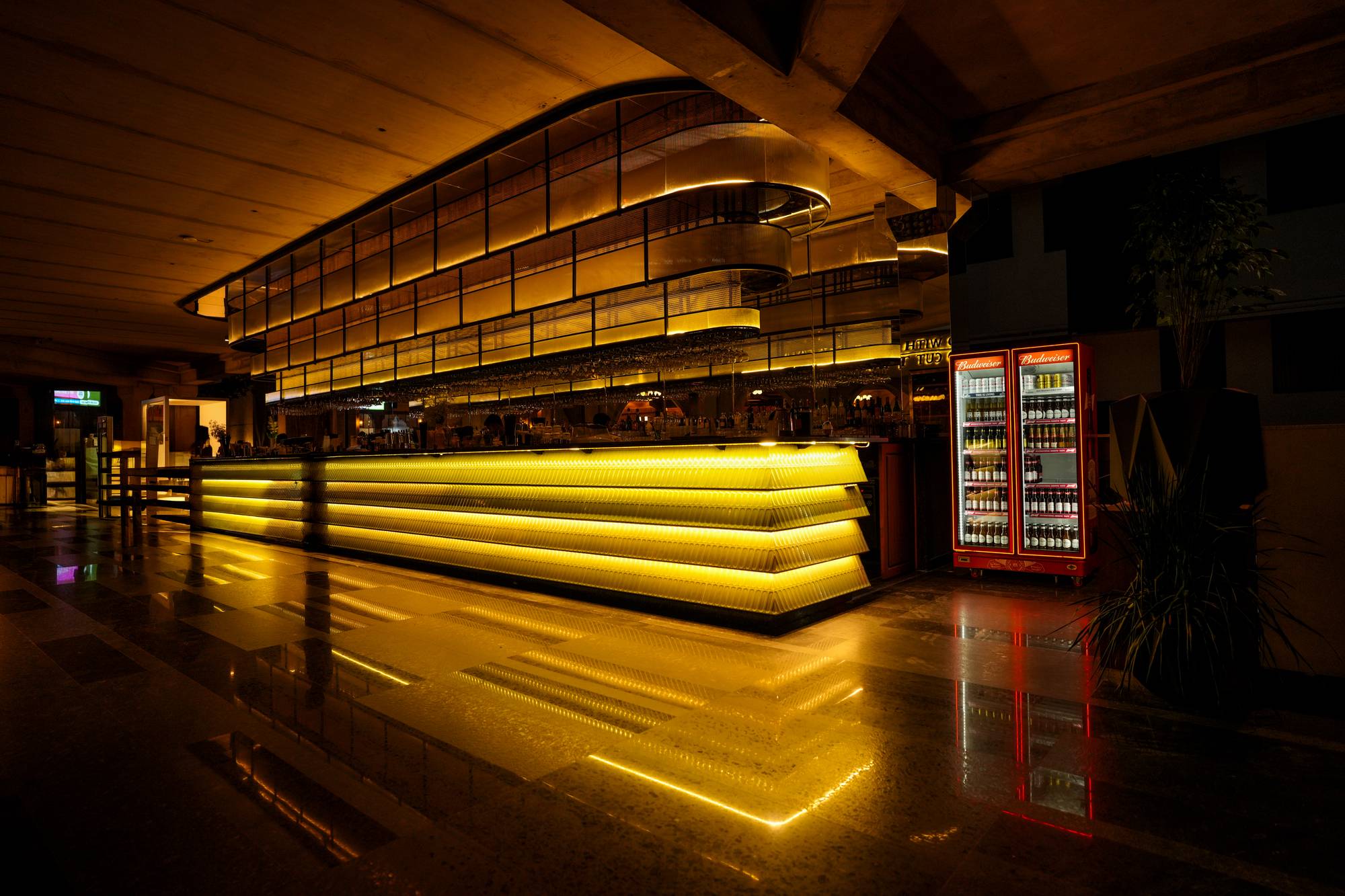 Illuminated gold brewhouse bar counter at Legacy Brewing Company