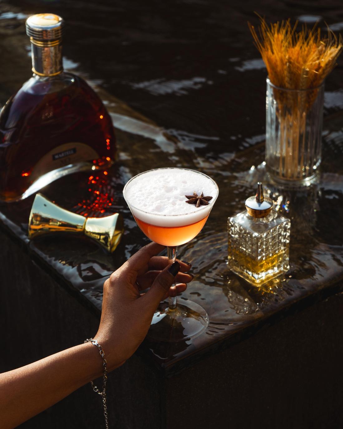 Cocktail held up in evening light