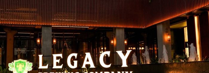 Close-up of the illuminated Legacy Brewing Company sign